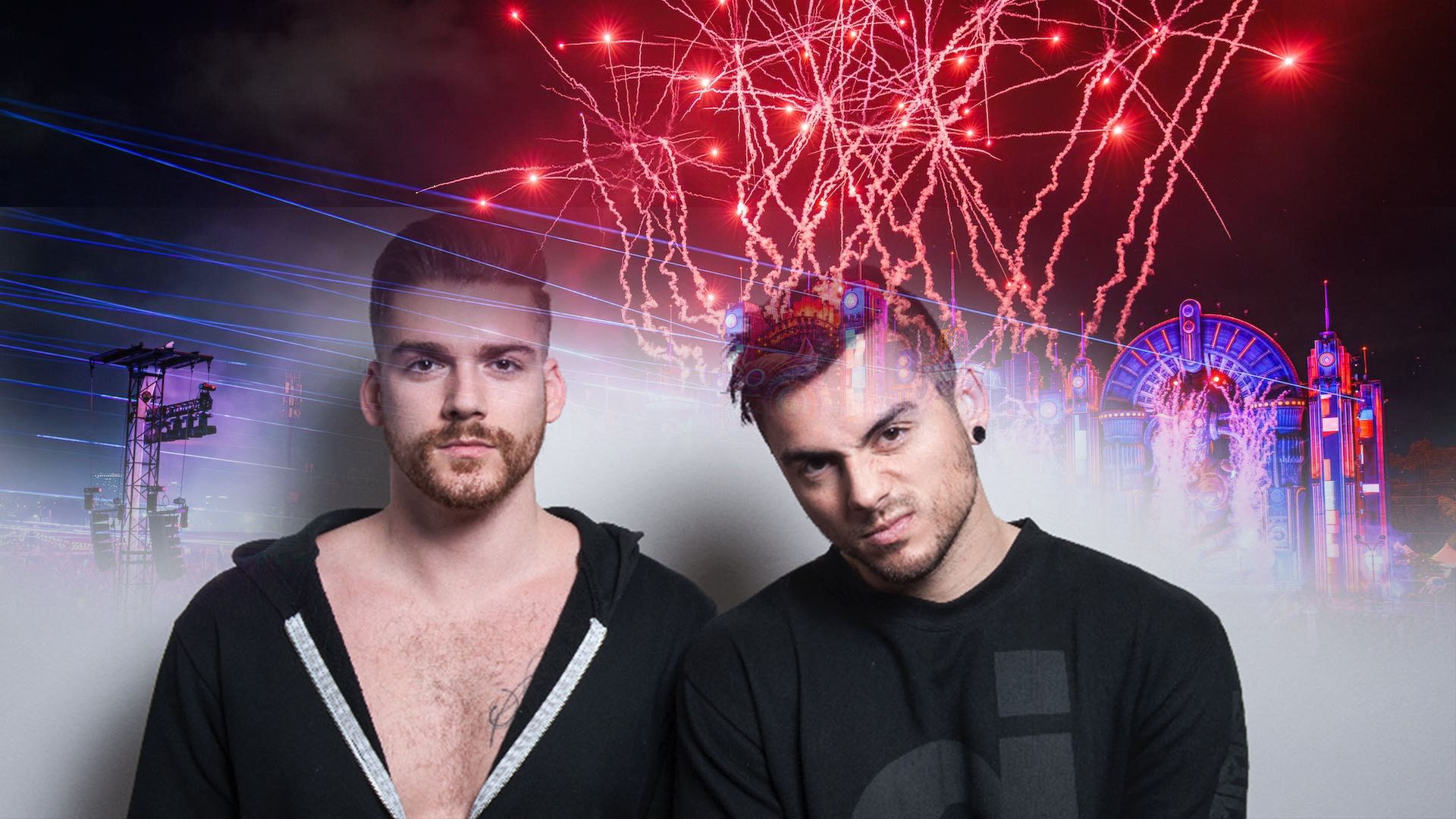 Adventure Club in dark clothing pose against a vibrant backdrop of neon pink and blue stage lights and festival structures.